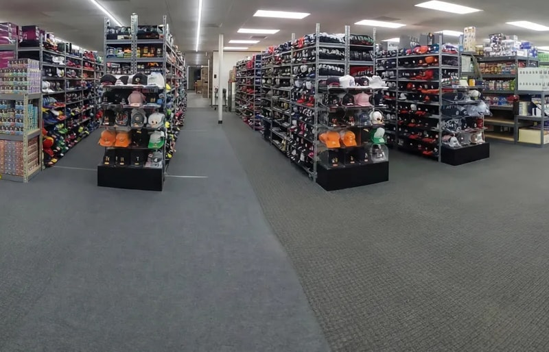 Aisles of stocked display fixtures on the Warner Wireless Gears Houston showroom floor