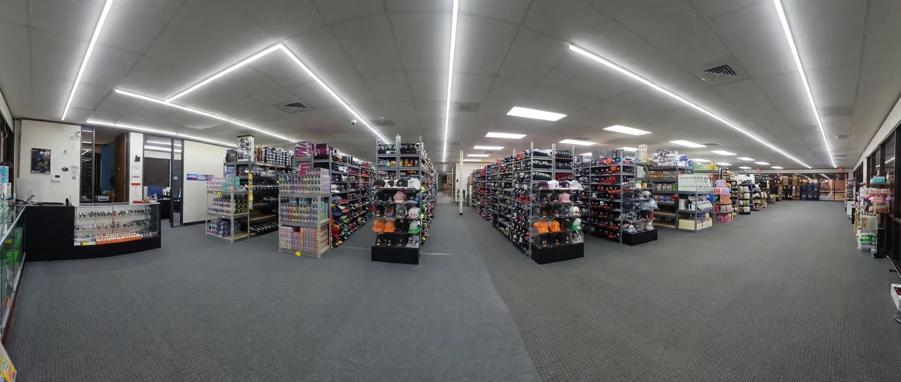 Warner Wireless Gears Houston wholesale showroom floor with accessory and cap displays